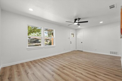 Unfurnished room with light hardwood / wood-style 