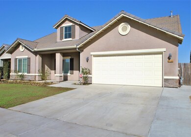 Front View, newly seeded lawn area, tile roof, stu