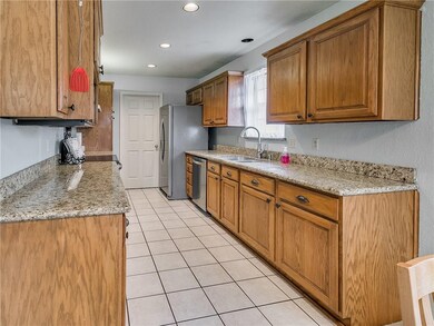 Kitchen with granite countertops and lots of stora