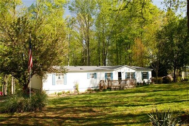 Front of house with flag pole.