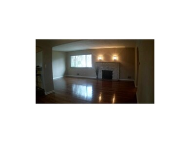 Living Room with wood burning FP & refinished hard