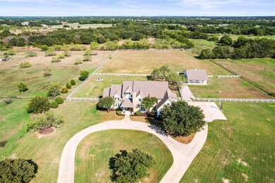 Birds eye view of property with a rural view