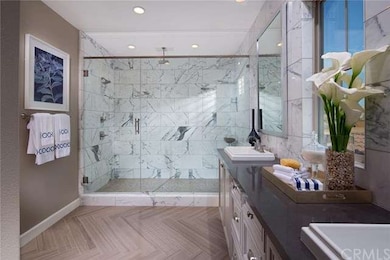 Luxurious master bathroom with dual sinks and larg