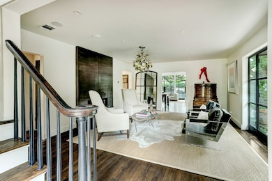  Sophistication and elegance encompass the front living room, adding to the grandeur that this home offers.