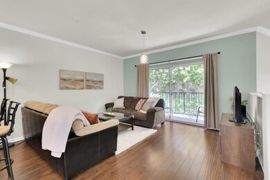 Living area with ornamental molding and wood fini