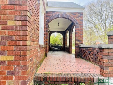very cool front porch! with steps to attached bric
