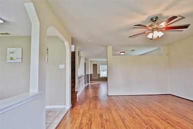 spacious, open-concept  family room with warm wood