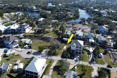 Aerial view with a water view and a residential vi