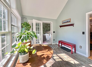 Enter the home through the sun-filled porch
