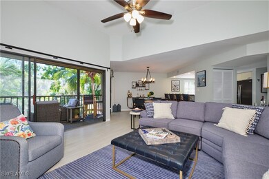 Living area featuring ceiling fan with notable cha
