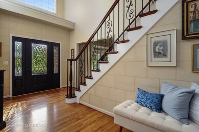 WELCOMING ENTRANCE WITH CUSTOM DOOR, HARDWOOD FLOO