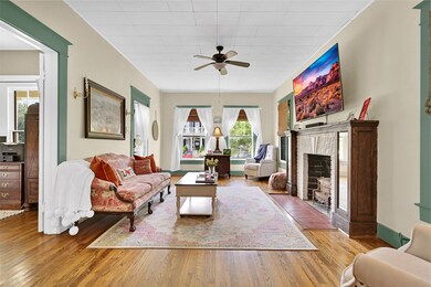 The stunning original fireplace still retains the