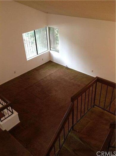 View from upstairs looking at the livingroom area.