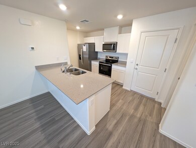 Kitchen with appliances with stainless steel finis