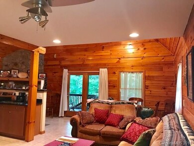 Great room with alley kitchen to left in this phot