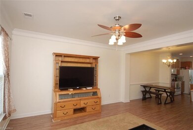 The living room opens to the dining room and kitchen.