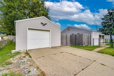 Detached garage featuring driveway