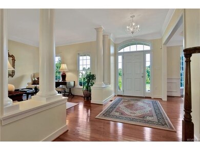 Foyer showing living room on one side and the dining room on the other.