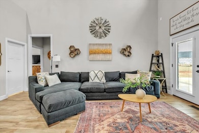 Living room with sunlight, 27 foot ceilings and li