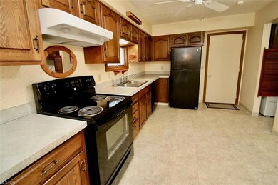 Kitchen featuring light countertops, black applian