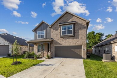 This photo showcases a modern, two-story brick hou