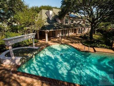 The sprawling backyard is truly a gem, landscaped