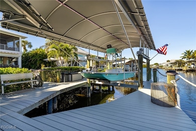 Dock area featuring boat lift and a water view