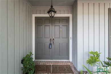 Beautiful double door entryway with brick accents 