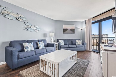 Living room with dark wood-type flooring