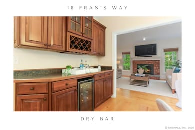 Contrasting dry bar and wine fridge for effortless