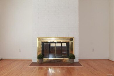Living room view of the 2 sided woodburning firepl