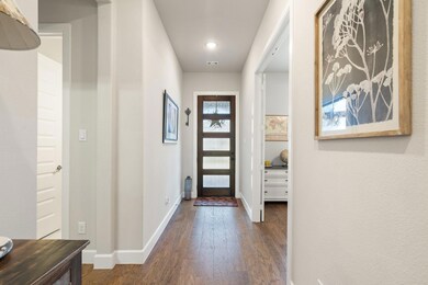 Foyer entrance featuring dark wood-type flooring