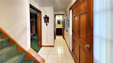 Entry with ceramic tile flooring