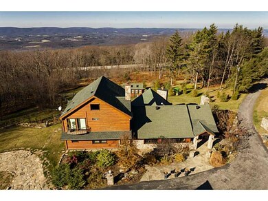 Aerial View. Rear of the home with west view of th