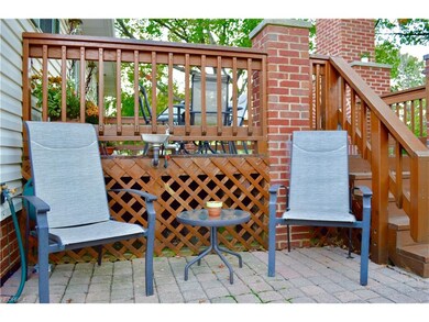 Adjacent to the deck is a large paver patio. This 