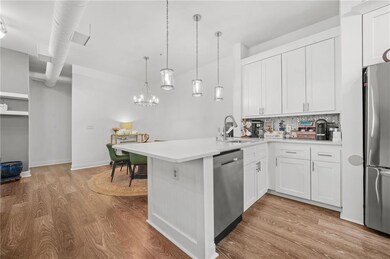 Kitchen featuring light countertops, a peninsula, 