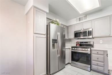 virtually decluttered: Kitchen featuring stainless