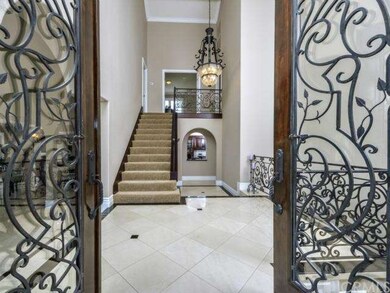 Remodeled entry foyer with marble tile flooring wi
