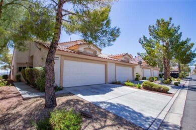 Attached two-car garage with spacious driveway for