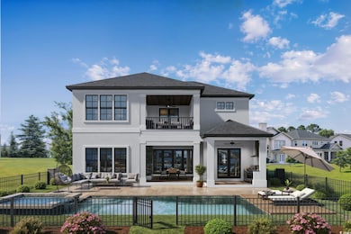 Rear view of property with a patio area, a fenced backyard, an outdoor hangout area, stucco siding, and a balcony