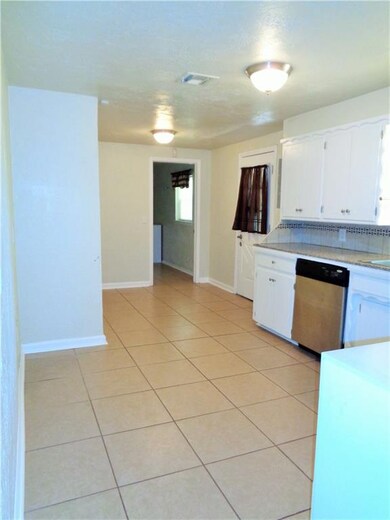 Remodeled kitchen with dining area. Utility and ga