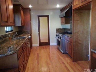 Gorgeous kitchen with custom cabinetry, granite an