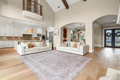 This spacious, elegant living area features high c