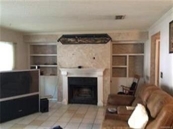 Spacious LR/DR with fireplace and built-ins.