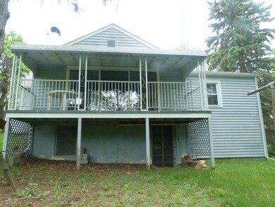 Large back porch to view the peaceful, large woode
