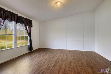 To the left of the entry is the second living room