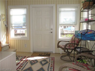 Rear lanai w/door to dock/lift.