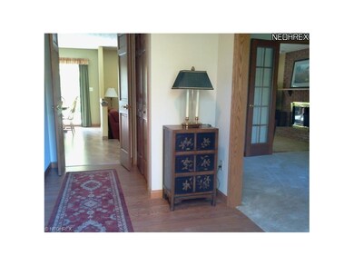 Foyer entrance with hardwood floors, dining room t