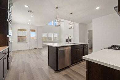 Kitchen with seamless flow to dining area & great room