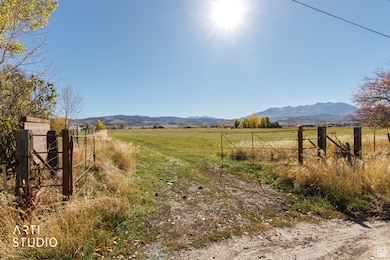 View of yard featuring a rural view and a mountain view